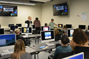 students critiquing artwork on screen